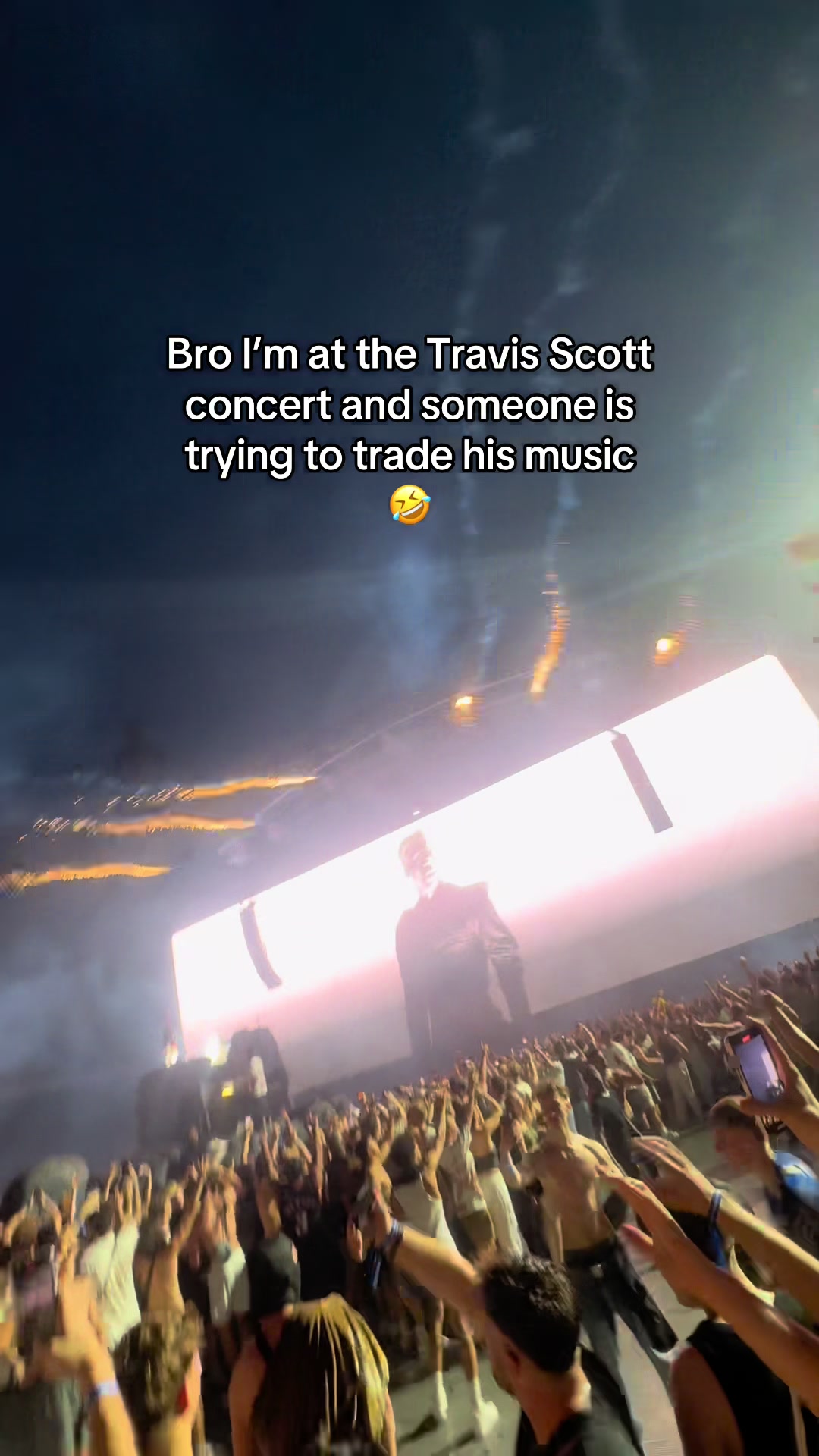 Bro I’m at the Travis Scott concert and someone is trying to trade his music 😂