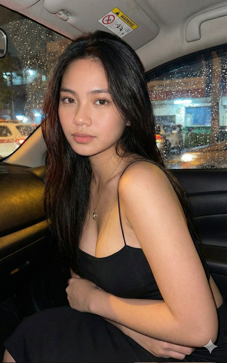 Candid Portrait of Young Woman in Rainy Night Car
