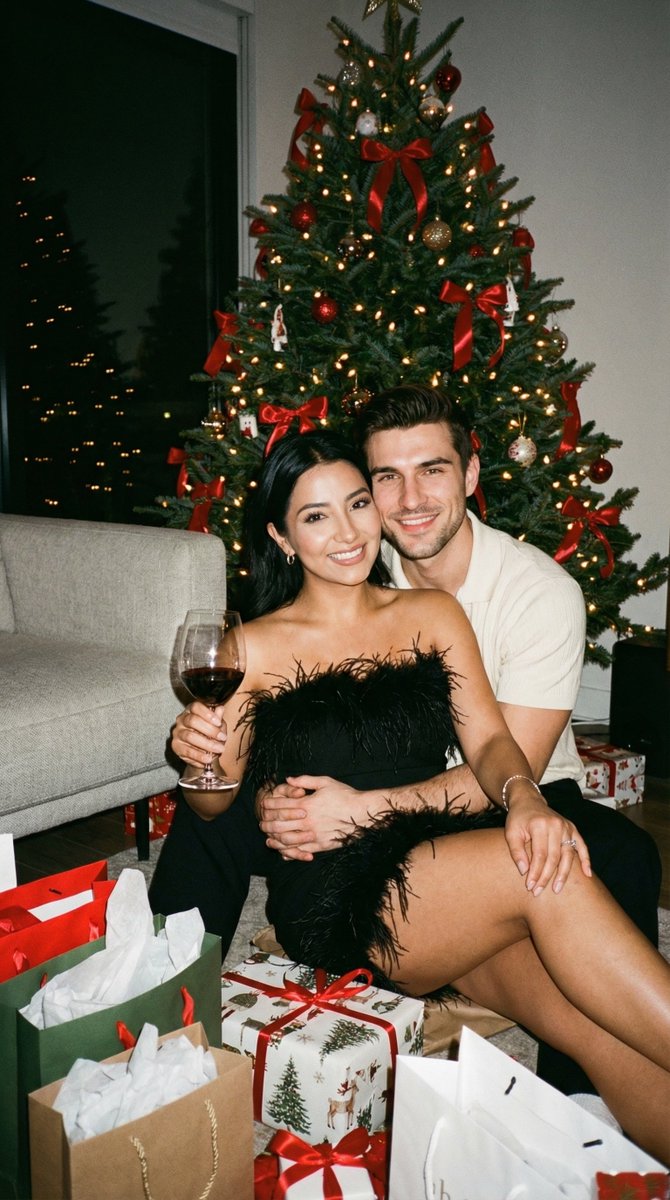 Joyful Couple Christmas Portrait with Festive Gifts