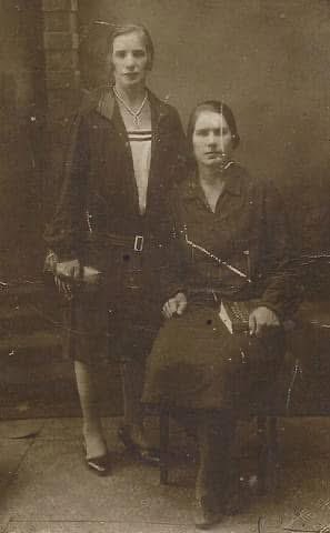 Vintage Sepia Portrait: Two Women in 1930s Fashion