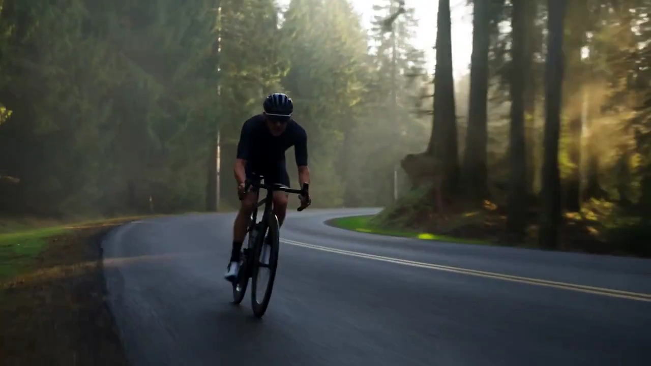 Cyclist's Thrilling Descent: Foggy Mountain Adventure
