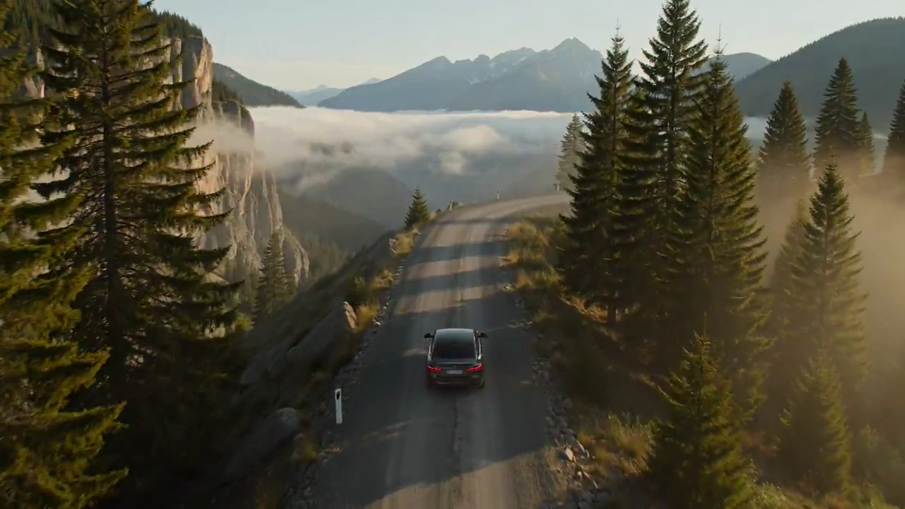 Serene Mountain Escape: A Car's Journey Through Misty Pines